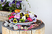 Flower bowl with Easter bunny on tree stump