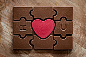 Valentine's Day chocolate puzzle with red heart in the middle