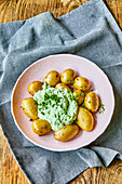 Potatoes with herb-cheese sauce