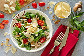 Italian mushroom salad with arugula, tomatoes and parmesan cheese