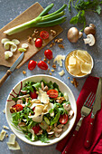 Italian mushroom salad with rocket, tomatoes and parmesan cheese