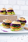 Vegan mini burgers with red cabbage and fried soy daillons