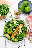 Salmon from the oven on avocado-rocket salad