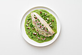 Sea bass fillet with pea sauce