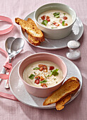 Creamy celery soup with bacon and toasted bread