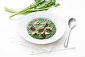 Cream of broccoli rabe soup with anchovies, leeks and whole wheat pasta