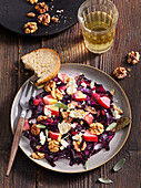 Warm red cabbage salad with feta cheese and walnuts