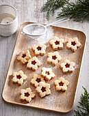 Linz flower cookies with redcurrant jam