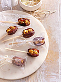 Dates on a stick filled with caramel nuts