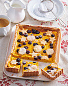 Pumpkin pie with curd cheese and blueberries