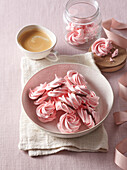 Pink meringues with chocolate cream filling
