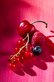 Red fruits on a red background