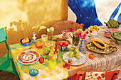 Colorfully laid table with fruit and vegetables