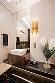 Elegant bathroom with black marble elements