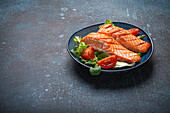 Grilled salmon steaks with vegetable salad