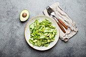 Vegan green salad with avocado, cucumber and edamame