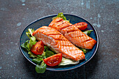 Grilled salmon steak with vegetable salad