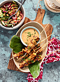 Tempeh skewers with spicy peanut sauce
