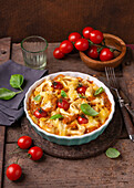 Vegan tortellini lentil casserole with tomatoes and basil