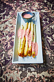 Grilled white asparagus with strawberry sauce