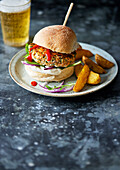 Thai salmon burger with potato wedges