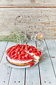 Layered Strawberry Cheese Cake With Slice Served on Glass Dish