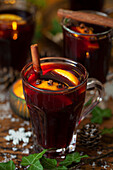 Mulled wine with oranges, cloves and cinnamon stick