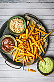 French fries with three dipping sauces