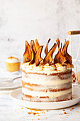 Naked cake with oven-dried pear chips and cookie crumbs