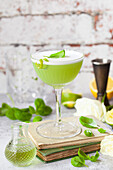 Gin cocktail with basil, lime and egg white foam