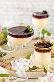 Lemon posset with blackberry sauce