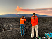 Scientists monitoring lava flows, Mauna Loa, Hawaii, USA