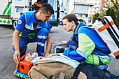 Paramedics treating patient