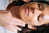Woman having a facial treatment