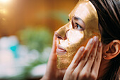 Gold face mask treatment