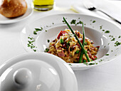 Parmesan-Risotto mit geräucherter Entenbrust und Erbsen