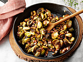 Pan-fried Brussels sprouts with diced ham and cashew nuts