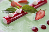 Dessert with mint cream and strawberries