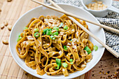 Tagliatelle Dandan Style with chili, Szechuan pepper, soy sauce and peanut butter