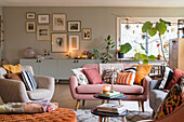 Modern living room with color-coordinated textiles and picture gallery