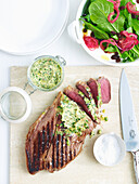 Steaks with caper butter and rocket salad