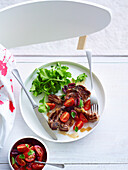 Lamb chops with tomato and olive salsa