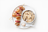 Pork and apple skewers with rice