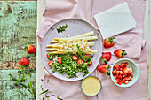 White asparagus with rocket and strawberry salad