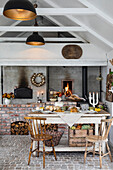 Set dining table in front of a rustic country-style stove