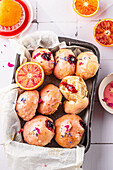 Vegan donuts with blood orange frosting and jam filling