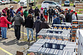 Volunteers praying before distributing food