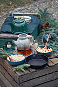 Winter outdoor breakfast with muesli and tea