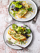 Vegetable strudel with asparagus sauce and spring salad