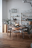 Set dining table and open shelf in Scandinavian style